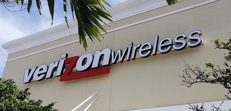 
              This Friday, Aug. 11, 2017, photo shows a Verizon wireless sign in Miami. Verizon is raising the price on its unlimited plan while introducing a slightly cheaper, more limited version of it as wireless carriers battle each other for customers. (AP Photo/Alan Diaz)
            