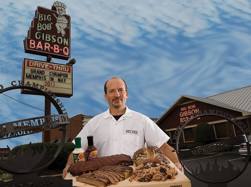 Grill master Chris Lilly of Big Bon Gibson's in Decatur, Ala., near Huntsville, the winner of two World BBQ Championships, shows off his prize meats. (Alabama Tourism Department/TNS)