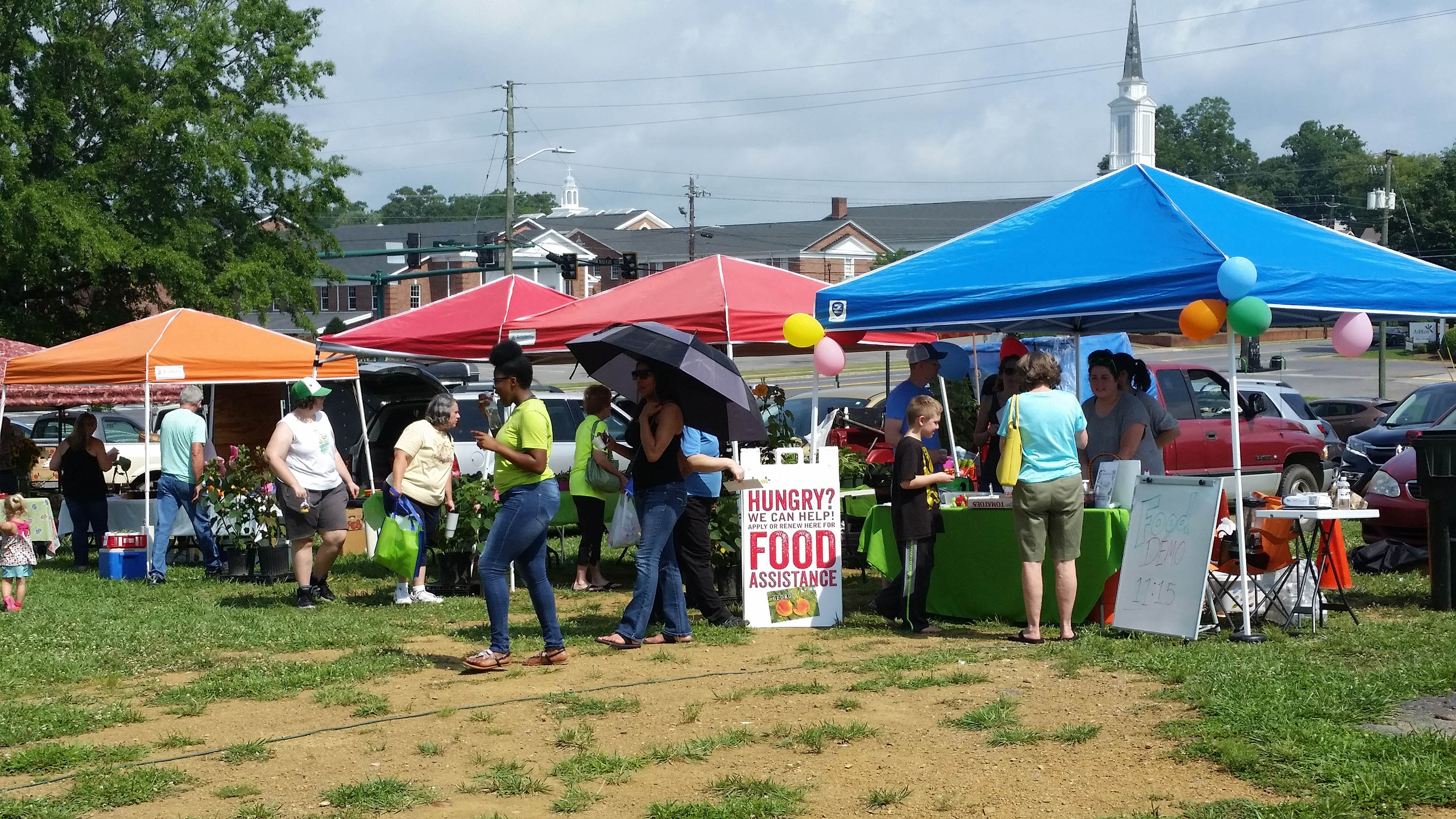 Patrons check out produce, crafts and more at the Downtown Dalton Farmers Market, a staple of summer Saturdays.
