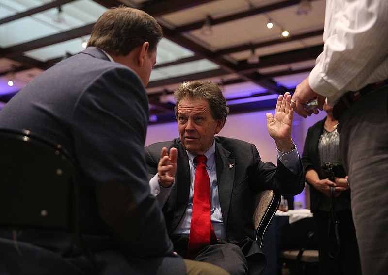 Chattanooga councilman Darrin Ledford speaks with Economist Arthur Laffer Wednesday, Aug. 23, 2017, after the annual Chattanooga Chamber of Commerce Meeting at the Chattanooga Convention Center. Laffer was the keynote speaker during the event. 