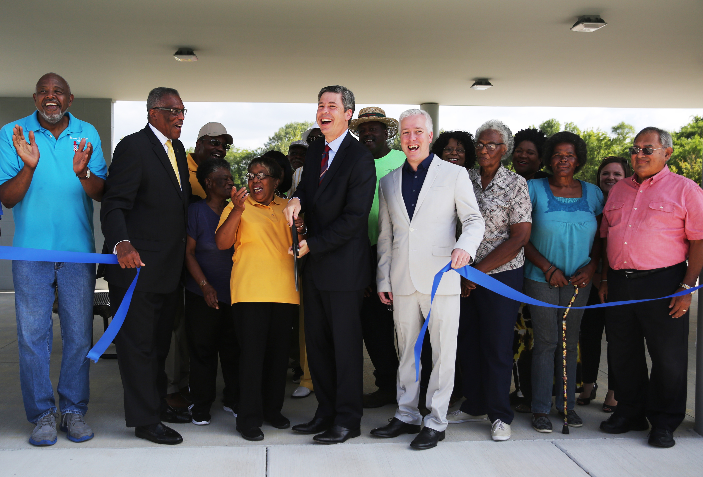 Residents, local politicians and community leaders participate in the ribbon cutting ceremony for the Southside Community Park in Chattanooga, Tenn., on Wednesday, Aug. 23, 2017. The park is located at the site where Charles A. Bell Elementary School was formerly located.