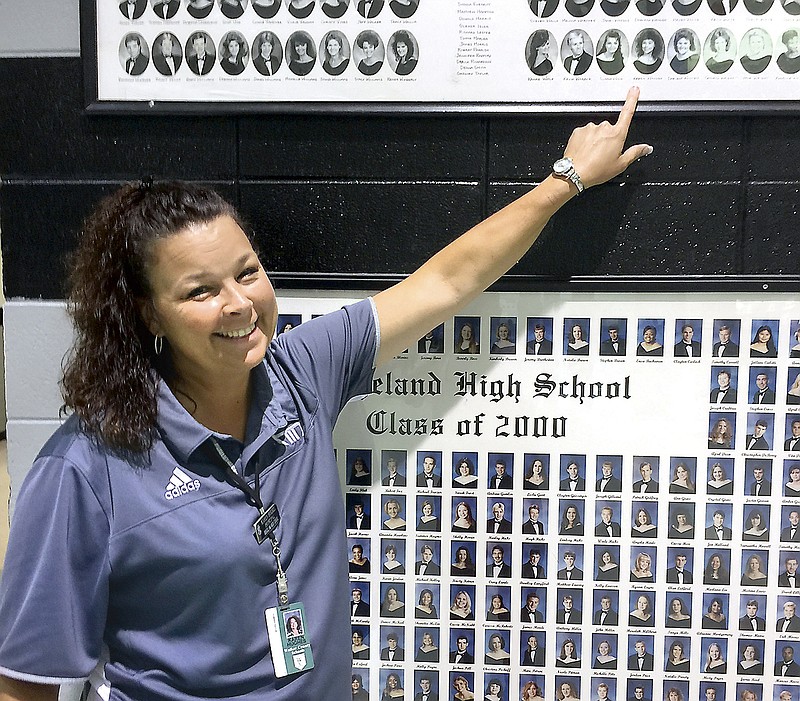 Karen Hughes, Ridgeland High School's new principal, points out her photo in the school's very first graduating class.