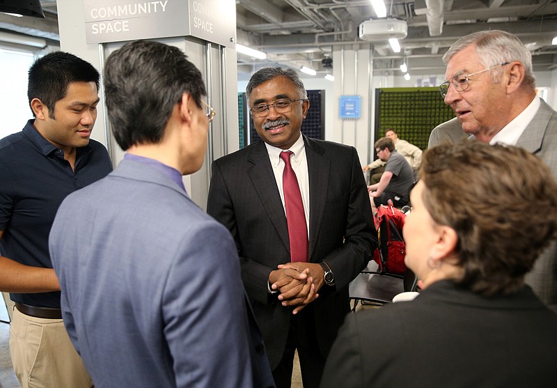 Thomas Zacharia, the Oak Ridge National Laboratory director, speaks with CEO of Variable George Yu, UTC Dean of the College of Engineering and Computer Science Daniel Pack, UTC Vice Chancellor of Research and Dean of the Graduate School Joanne Romagni, and EPB chairman Joe Ferguson Wednesday, Aug. 23, 2017, during Zacharia's visit to the Innovation District at the Edney Building in Chattanooga, Tenn. Zacharia became the Oak Ridge Lab director July 1.