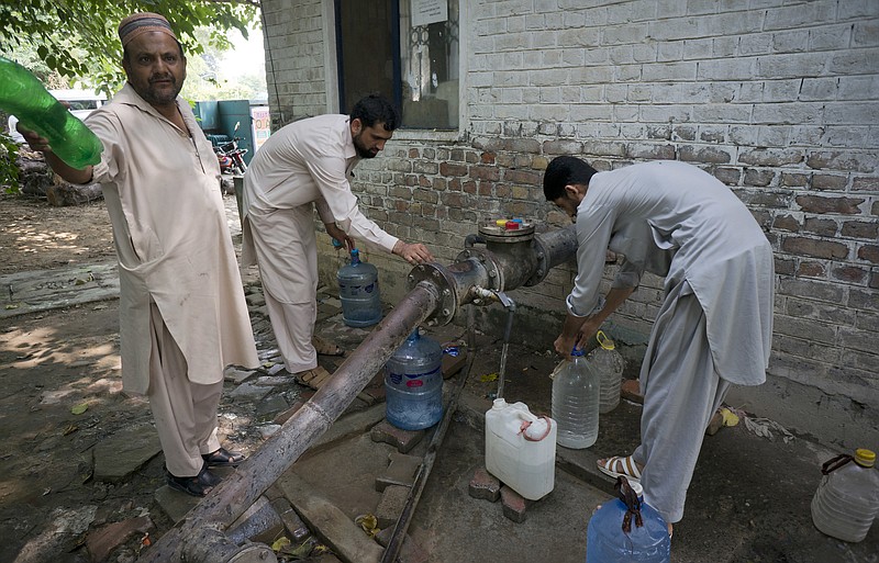 
              People collect water at a tube well in Islamabad, Pakistan, Wednesday, Aug. 23, 2017. A new study suggests some 50 million Pakistanis could be at risk of drinking arsenic-tainted groundwater. The findings are based on a hazard map built using water quality data from 1,200 tube wells in the densely populated Indus Valley. (AP Photo/B.K. Bangash)
            