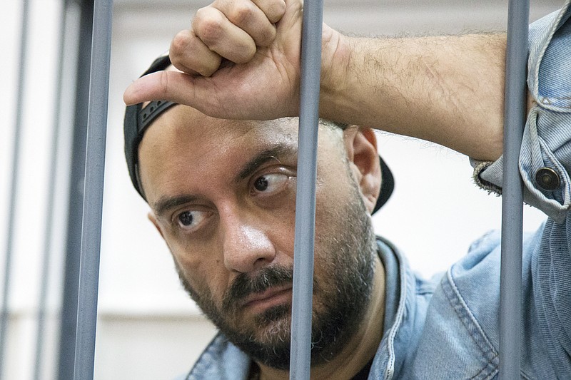 
              Russia's theater and film director Kirill Serebrennikov waits for hearings in a court in Moscow, Russia, Wednesday, Aug. 23, 2017. Serebrennikov is accused of embezzling 68 million rubles ($1.1 million) of government funds that were earmarked for a production at his theater, the Investigative Committee, which looks into high-profile crimes, said in a statement. (AP Photo/Alexander Zemlianichenko)
            