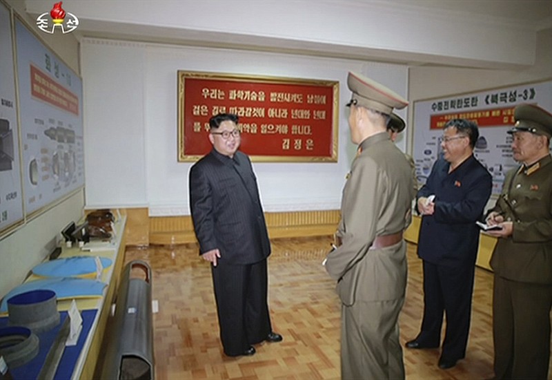 
              In this image made from video of a news bulletin aired by North Korea's KRT on Wednesday, Aug. 23, 2017, leader Kim Jong Un visits the Chemical Material Institute of Academy of Defense Science at an undisclosed location in North Korea. North Korea's state media released photos that appear to show concept diagrams of the missiles hanging on a wall behind leader Kim Jong Un, one showing a diagram for a missile called "Pukguksong-3." Independent journalists were not given access to cover the event depicted in this photo. (KRT via AP Video)
            