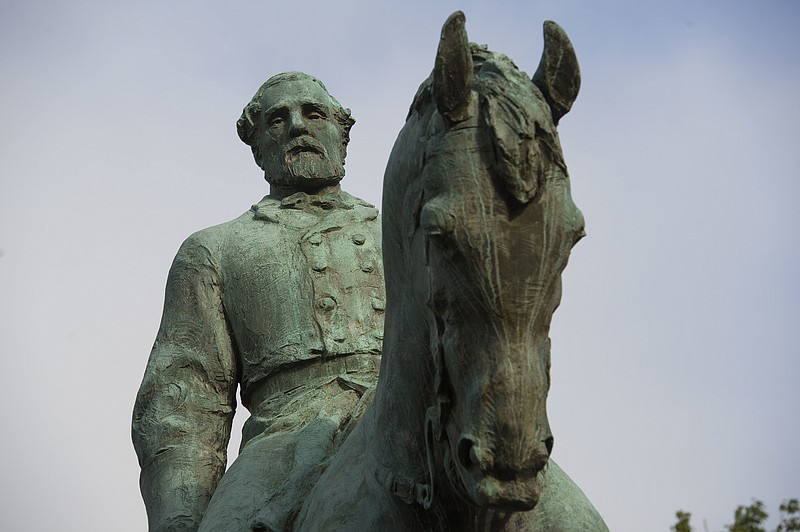 
              The statue of Confederate Army of Northern Virginia Gen. Robert E. Lee stands in Emancipation Park in Charlottesville, Va., Friday, Aug. 18, 2017. Charlottesville Mayor Mike Signer is expected to make an announcement regarding the Robert E. Lee statue later in the day. (AP Photo/Cliff Owen)
            