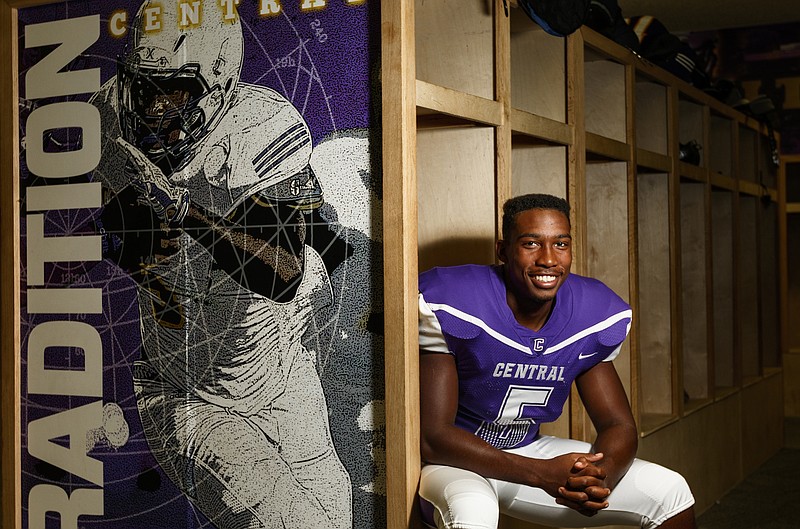 Central High School linebacker Vincent McColley poses for a portrait next to a picture of himself that is displayed prominently in the team's locker room on Thursday, Aug. 24, 2017, in Chattanooga, Tenn. McColley, who is now a senior, was dismissed from the team during his sophomore year, but he came back with a new attitude and is now team captain.