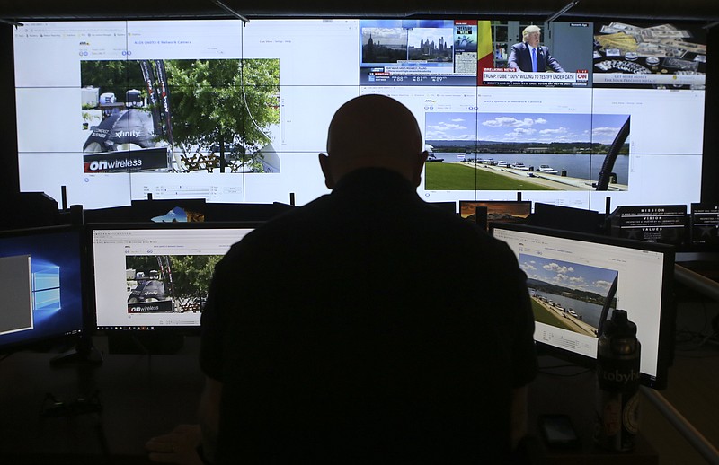 Staff file photo by C.B. Schmelter / Chattanooga Police Department Sgt. Billy Atwell demonstrates the capabilities of the real time intelligence center at the Police Services Center in June.