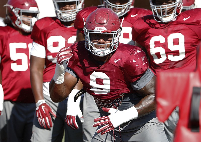 Alabama senior defensive lineman Da'Shawn Hand (9) goes through a drill Thursday afternoon, when the top-ranked Crimson Tide turned full attention to their opener against No. 3 Florida State.