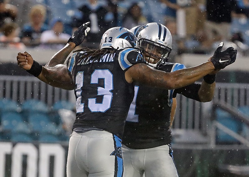 
              Carolina Panthers quarterback Cam Newton (1) celebrates after throwing a pass for a touchdown to wide receiver Kelvin Benjamin (13) during the first half of an NFL preseason football game against the Jacksonville Jaguars, Thursday, Aug. 24, 2017, in Jacksonville, Fla. (AP Photo/Stephen B. Morton)
            