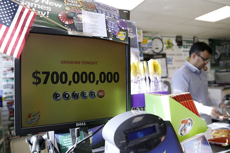 A Powerball lottery sign displays the lottery prizes at a convenience store Wednesday, Aug. 23, 2017, in Northbrook, Ill. Lottery officials said the grand prize for Wednesday night's drawing has reached $700 million, the second -largest on record for any U.S. lottery game. (AP Photo/Nam Y. Huh)