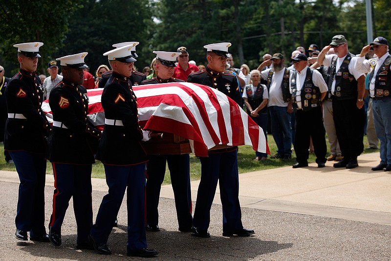 United States Marines bear the casket of U.S. Marine Cpl. Henry Andregg, Jr., of Whitwell, Tenn., from a hearse for his funeral service at the Chattanooga National Cemetery on Friday, Aug. 25, 2017, in Chattanooga, Tenn. Cpl. Andregg was killed during the Battle of Tarawa in World War II, but his remains were only recently identified through DNA testing.
