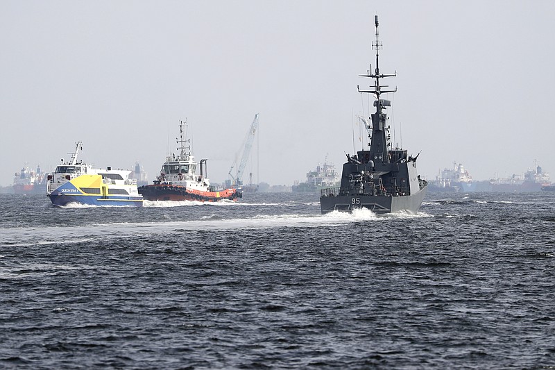 
              The Republic of Singapore Navy's RSS Brave, right, sails off from the Tuas naval base on a search and rescue mission for the USS John S. McCain's missing sailors on Thursday, Aug. 24, 2017, in Singapore. Aircraft and ships from the navies of Singapore, Malaysia, Indonesia and Australia are searching seas east of Singapore where the collision between the USS John S. McCain and an oil tanker happened early Monday. (AP Photo/Wong Maye-E)
            