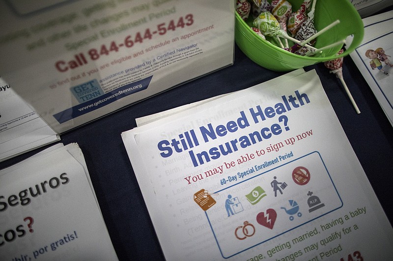 Information flyers for health insurance enrollment through the Affordable Care Act are displayed at a back-to-school event at the Martha O'Bryan Center in Nashville on Aug. 4., 2017. Counselors are starting earlier than usual to encourage enrollment in Obamacare, even as the Trump administration works against them. (Joe Buglewicz/The New York Times)