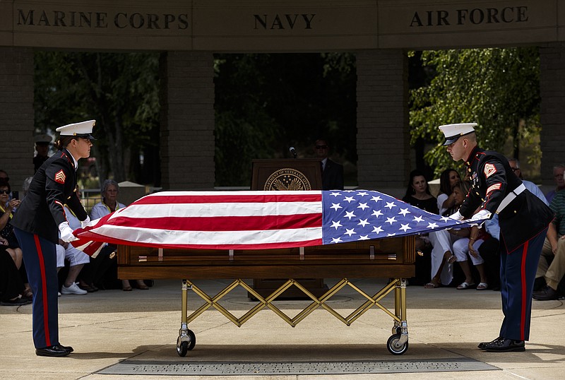 U.S. Marine Corps Gunnery Sgt. Lance Waller, right, and Sgt. Amanda Vincent prepare to fold the flag above the casket of Cpl. Henry Andregg, Jr., of Whitwell, Tenn., during a funeral service with full military honors at the Chattanooga National Cemetery on Friday, Aug. 25, 2017, in Chattanooga, Tenn. Cpl. Andregg was killed during the Battle of Tarawa in World War II's Pacific Theater, but his remains were only recently identified through DNA testing. Previously interred at the National Memorial Cemetery of the Pacific in Honolulu, Cpl. Andregg was returned home for burial nearly 74 years after his death.