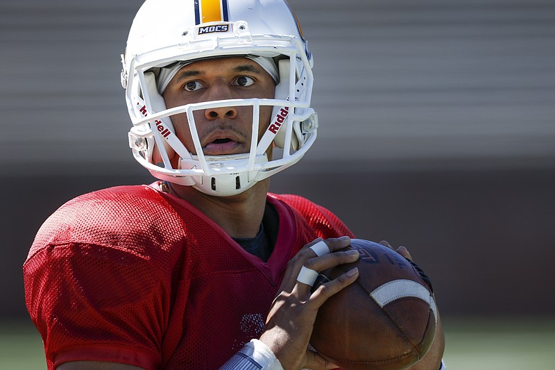 UTC quarterback Alejandro Bennifield looks for an open receiver during UTC's spring football game day at Finley Stadium on Saturday, April 8, 2017, in Chattanooga, Tenn. This year's spring game was an open practice followed by a 40 minute scrimmage.