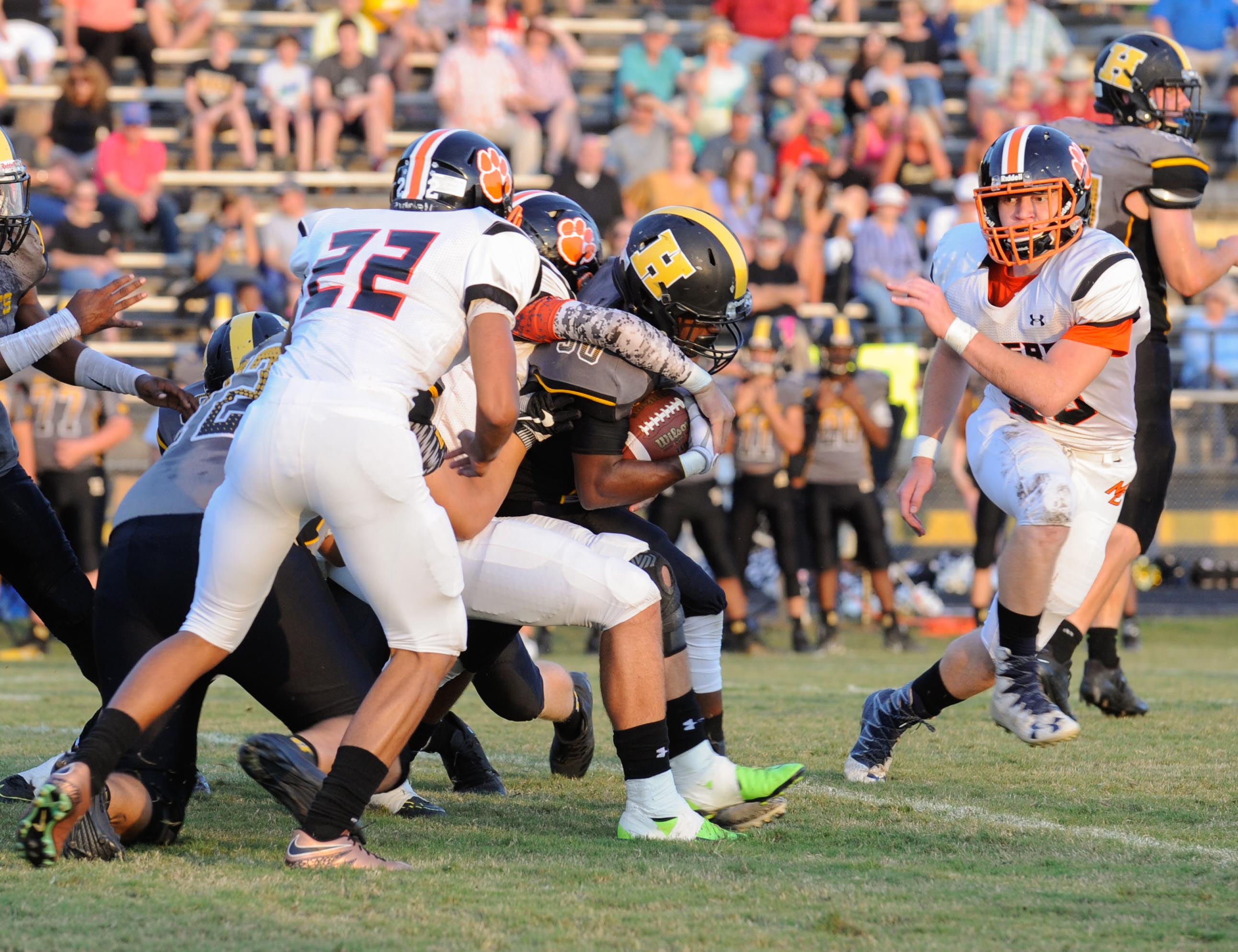 (Photo by Mark Gilliland) Hixson's Josiah Bowman tries to break away from Meigs County Dalton Baker during the game on August 25, 2017.