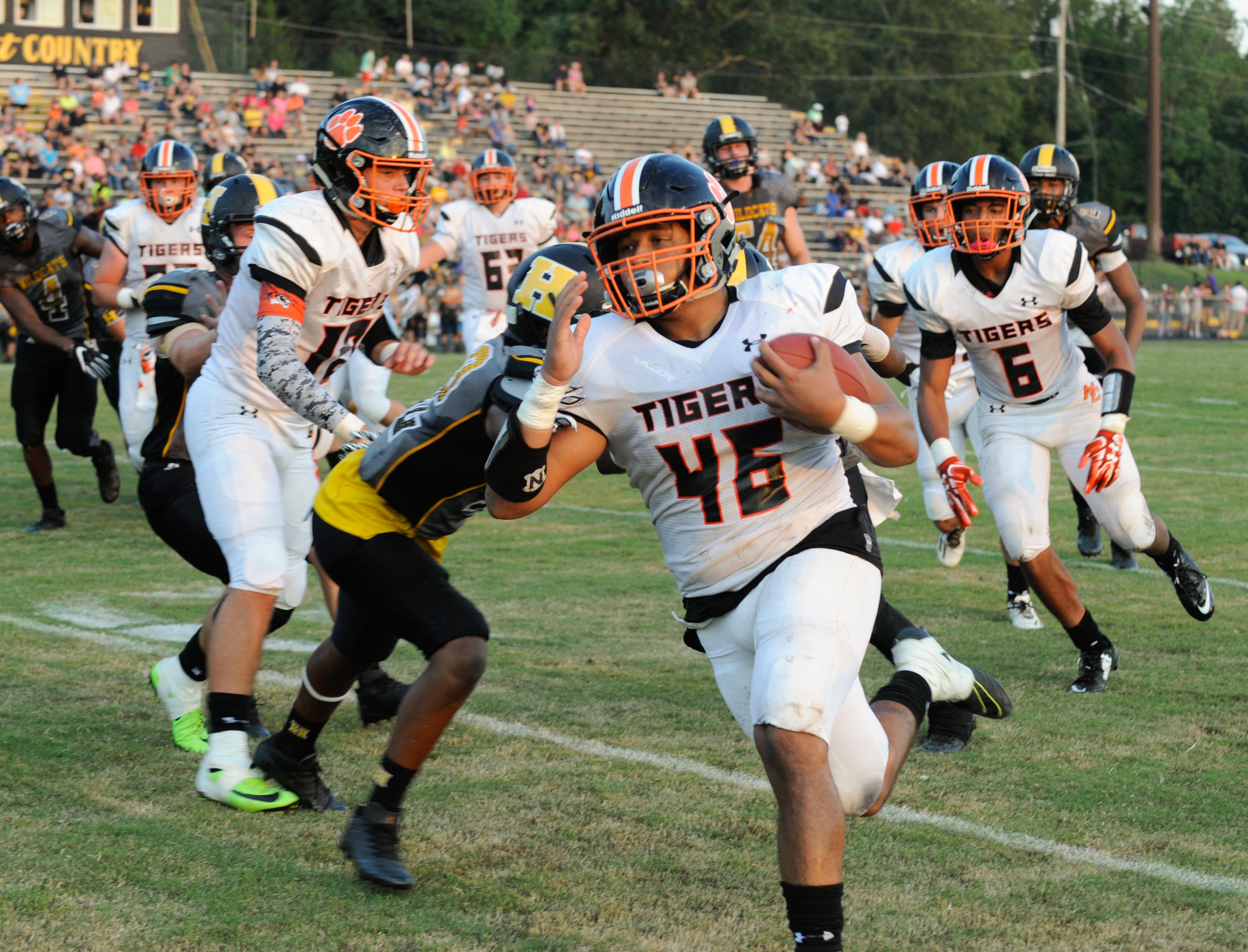 (Photo by Mark Gilliland) Meigs County Griffth Mcdowell breaks a tackle against Hixson for a touchdown during the game on August 25, 2017.