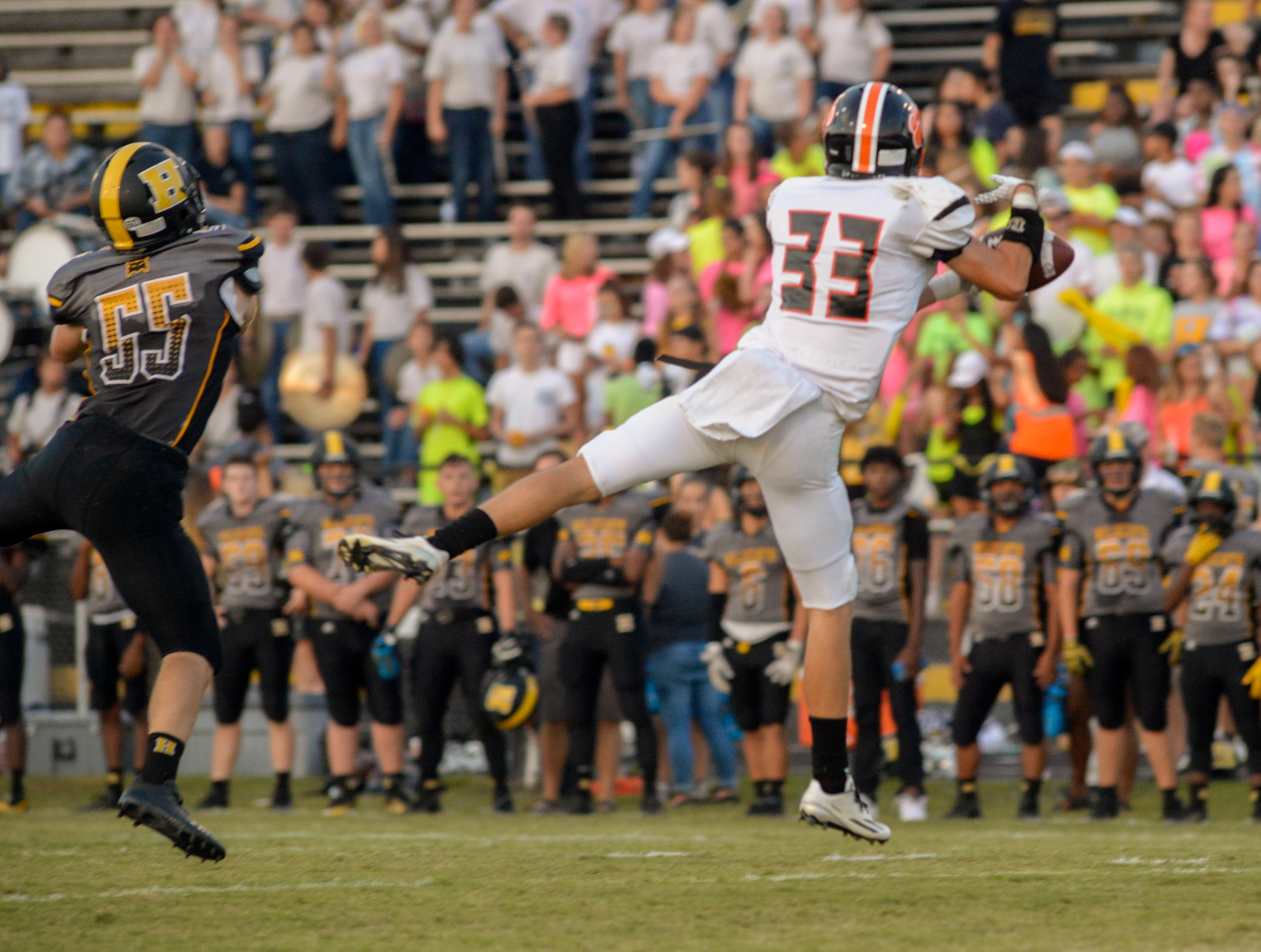 (Photo by Mark Gilliland) Meigs County Caleb Hyde catching a ball during the game on August 25, 2017.