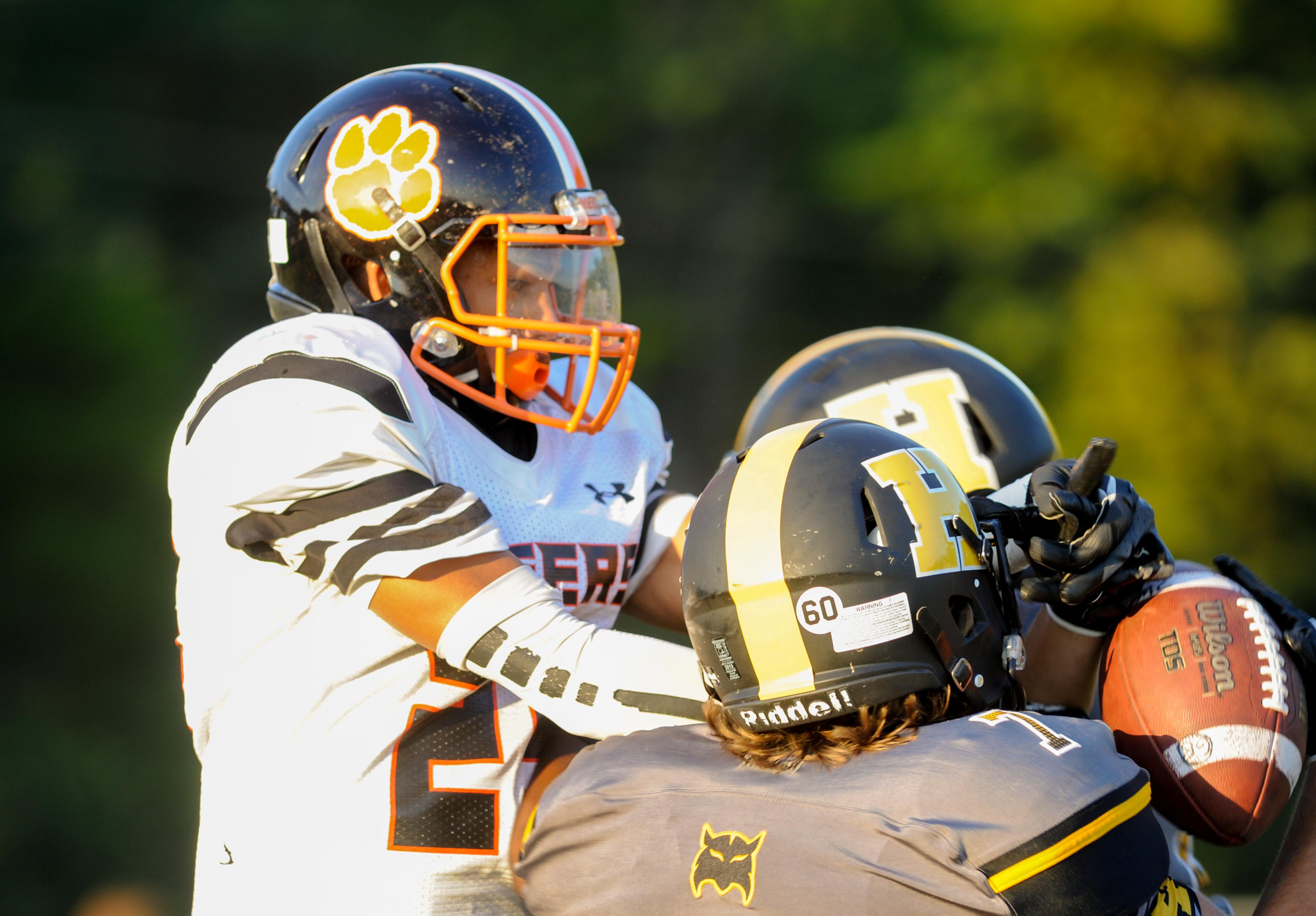 (Photo by Mark Gilliland) Hixson's Xavier Williams makes and interception against Meigs County Jon jon Beeler during the game on August 25, 2017.
