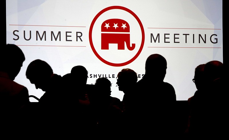 
              People talk before the start of the meeting of the standing committee on rules at the Republican National Committee summer meeting, Thursday, Aug. 24, 2017, in Nashville, Tenn. (AP Photo/Mark Humphrey)
            