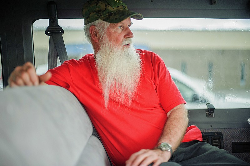 
              In this undated photo, James Green, co-leader of the Aggressive Christianity Missions Training Corps, waits in the parking lot of the Cibola County Magistrate Court in Grants, N.M. Four members of the New Mexico paramilitary religious sect rocked by child sexual abuse allegations were arrested while trying to flee the state in two vans full of children, authorities said Thursday, Aug. 24, 2017. (Adron Gardner/Gallup Independent via AP)
            