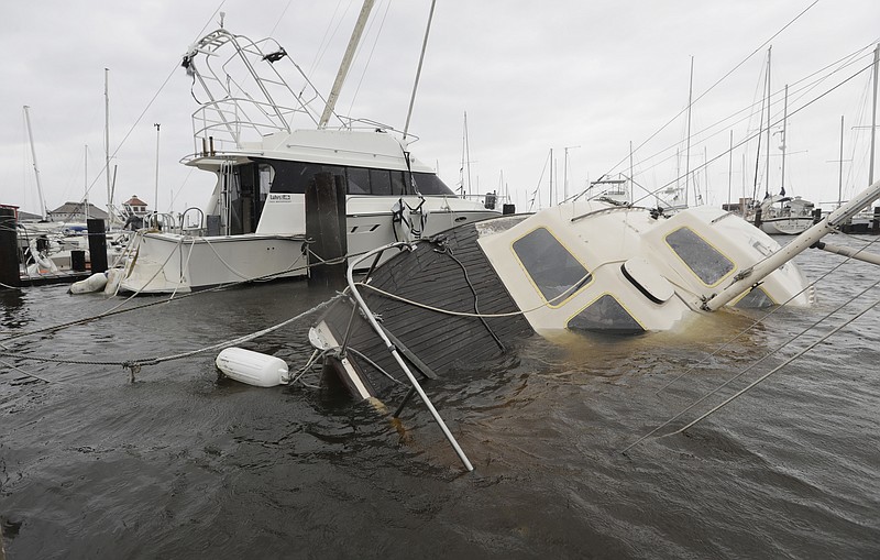 
              A boat is partially submerged in the wake of Hurricane Harvey, Saturday, Aug. 26, 2017, in Rockport, Texas. (AP Photo/Eric Gay)
            