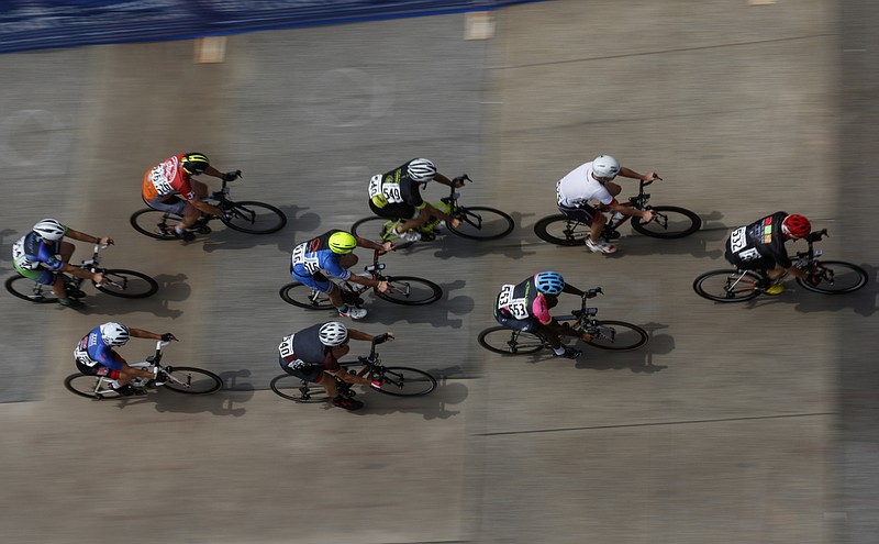 Cyclists compete in the Men's Cat 5 Criterium race of the River Gorge Omnium cycling competition on Saturday, Aug. 26, 2017, in Chattanooga, Tenn. The three-days of races began with time trials on Friday and criterium races on Saturday, and it concludes with road races on Sunday.