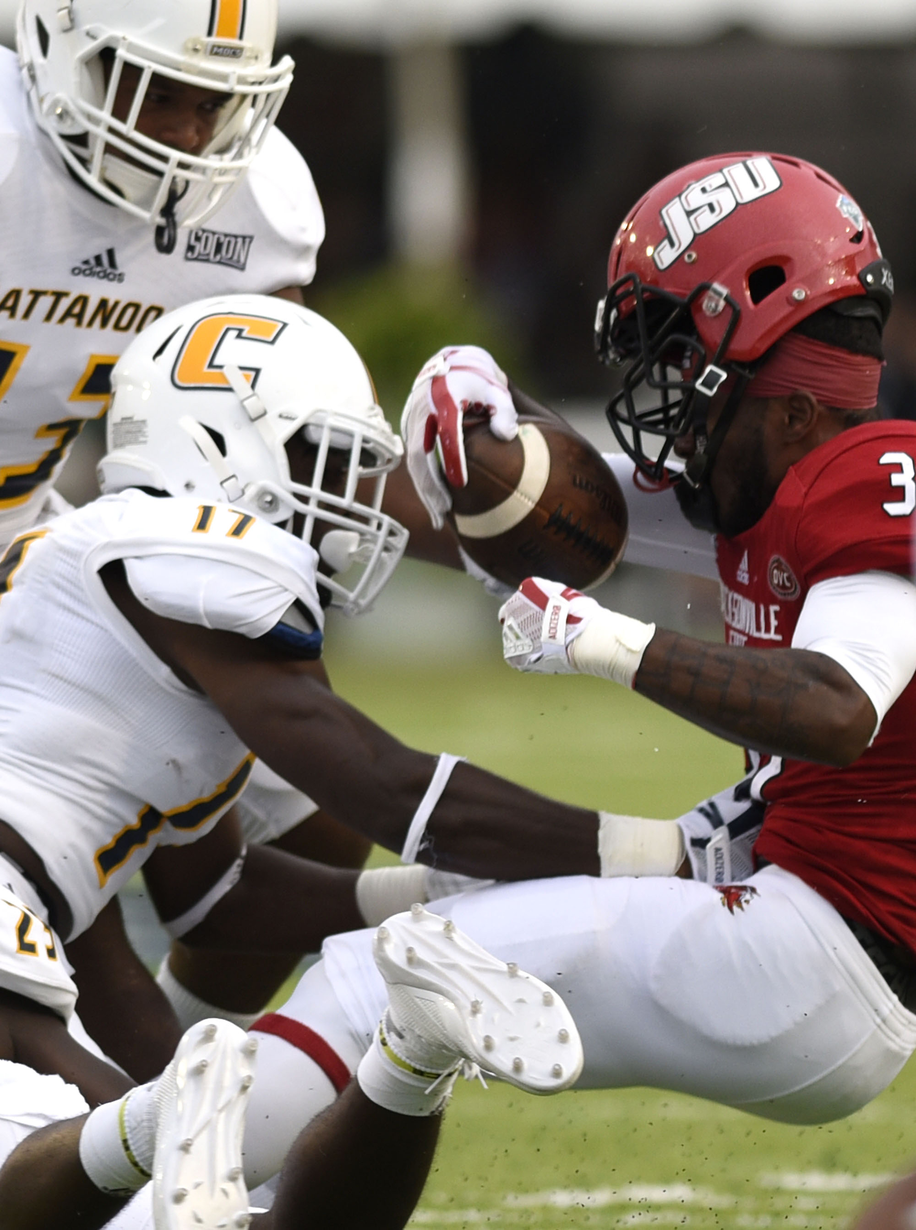 UTC's Brandon Dowell's (17) knocks the helmet off Jacksonville's De'Marcus Flower's (37) helmet. The University of Chattanooga Mocs met the Jacksonville State Gamecocks in the Guardian Credit Union FCS Kickoff at the Carmton Bowl in Montgomery, Alabama on August 26, 2017.