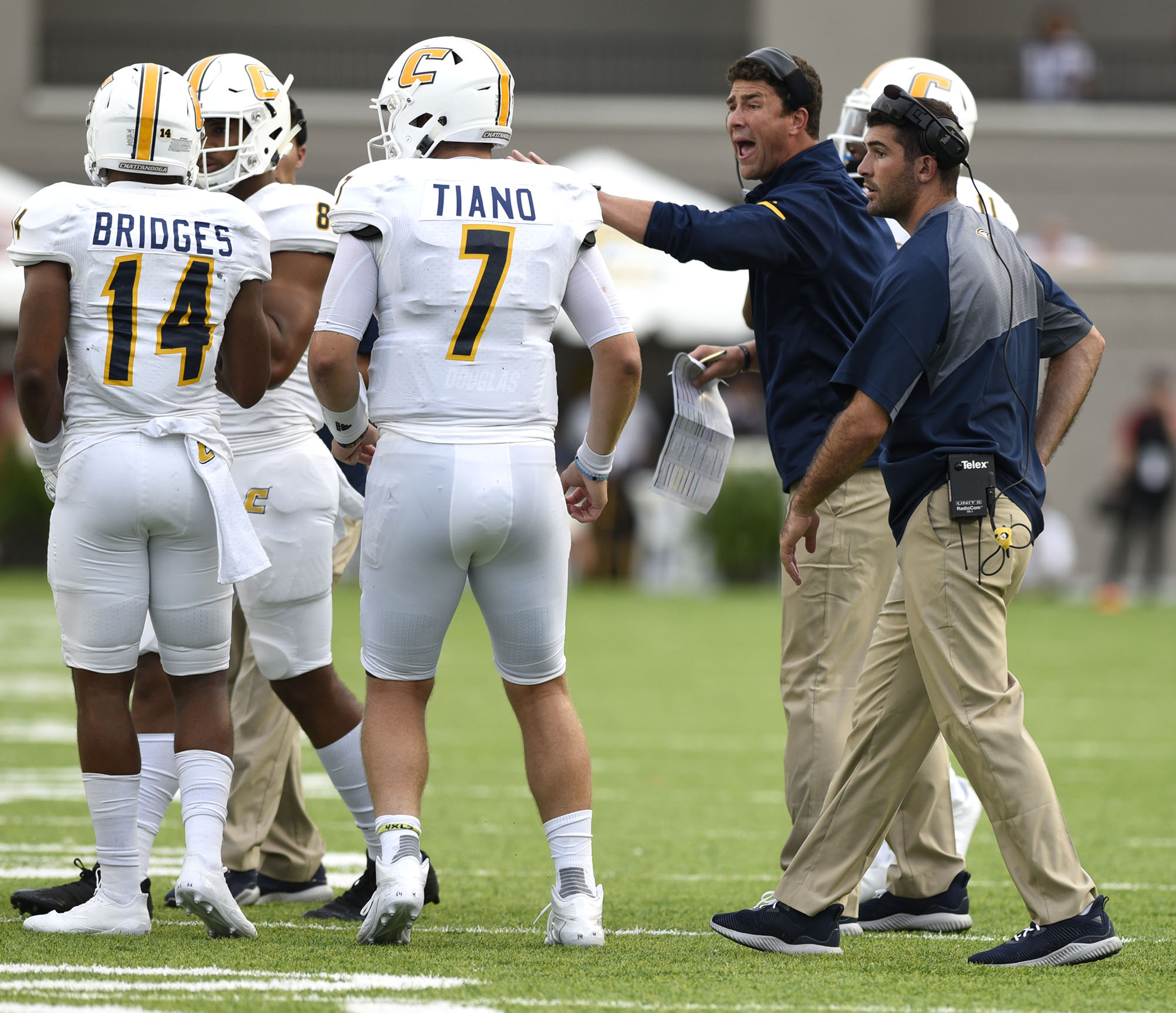 UTC head coach Tom Arth, second from right, tries to rally the offense. The University of Chattanooga Mocs met the Jacksonville State Gamecocks in the Guardian Credit Union FCS Kickoff at the Carmton Bowl in Montgomery, Alabama on August 26, 2017.