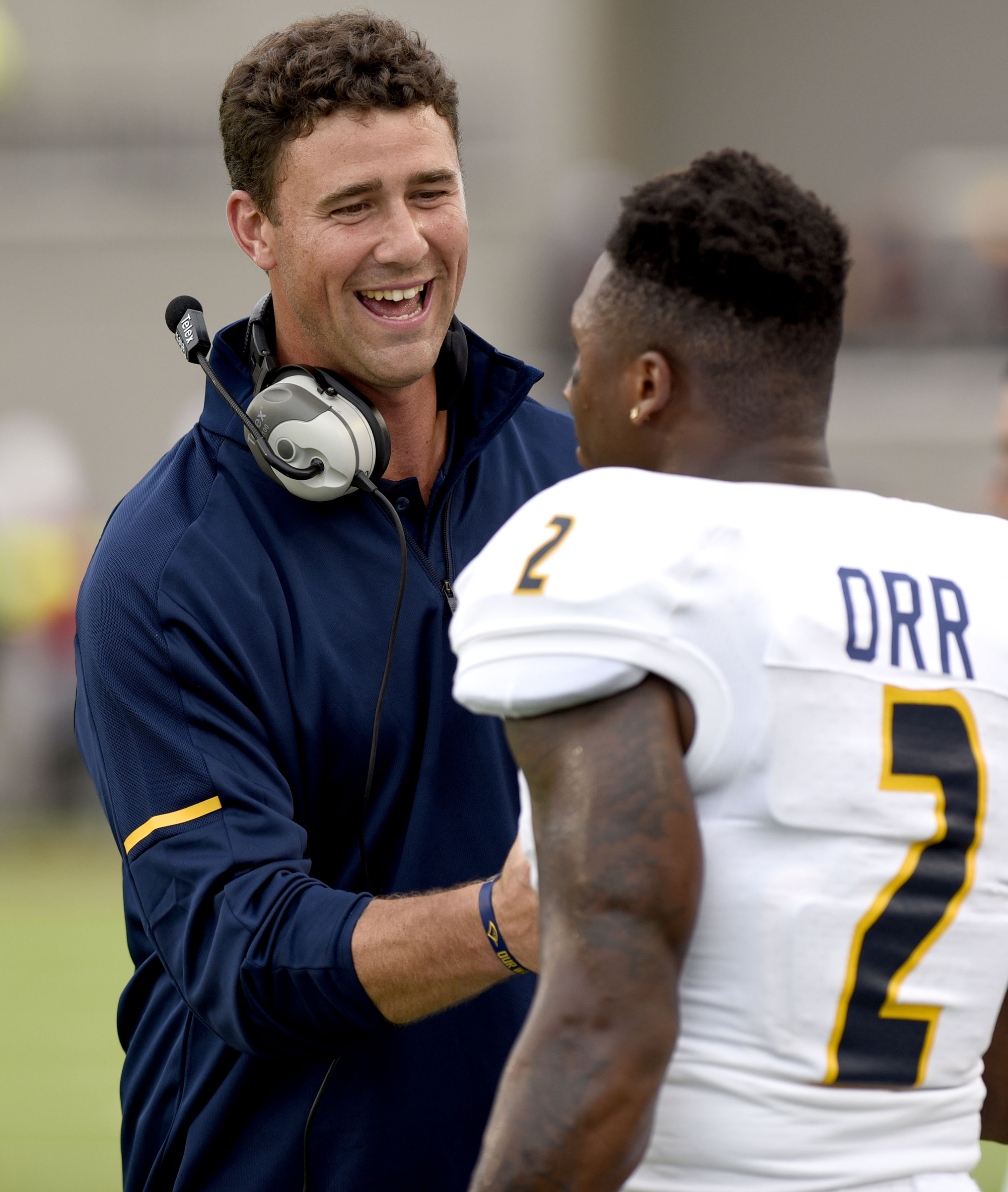 UTC head coach Tom Arth talks with Kareem Orr (2) before the game. The University of Chattanooga Mocs met the Jacksonville State Gamecocks in the Guardian Credit Union FCS Kickoff at the Carmton Bowl in Montgomery, Alabama on August 26, 2017.