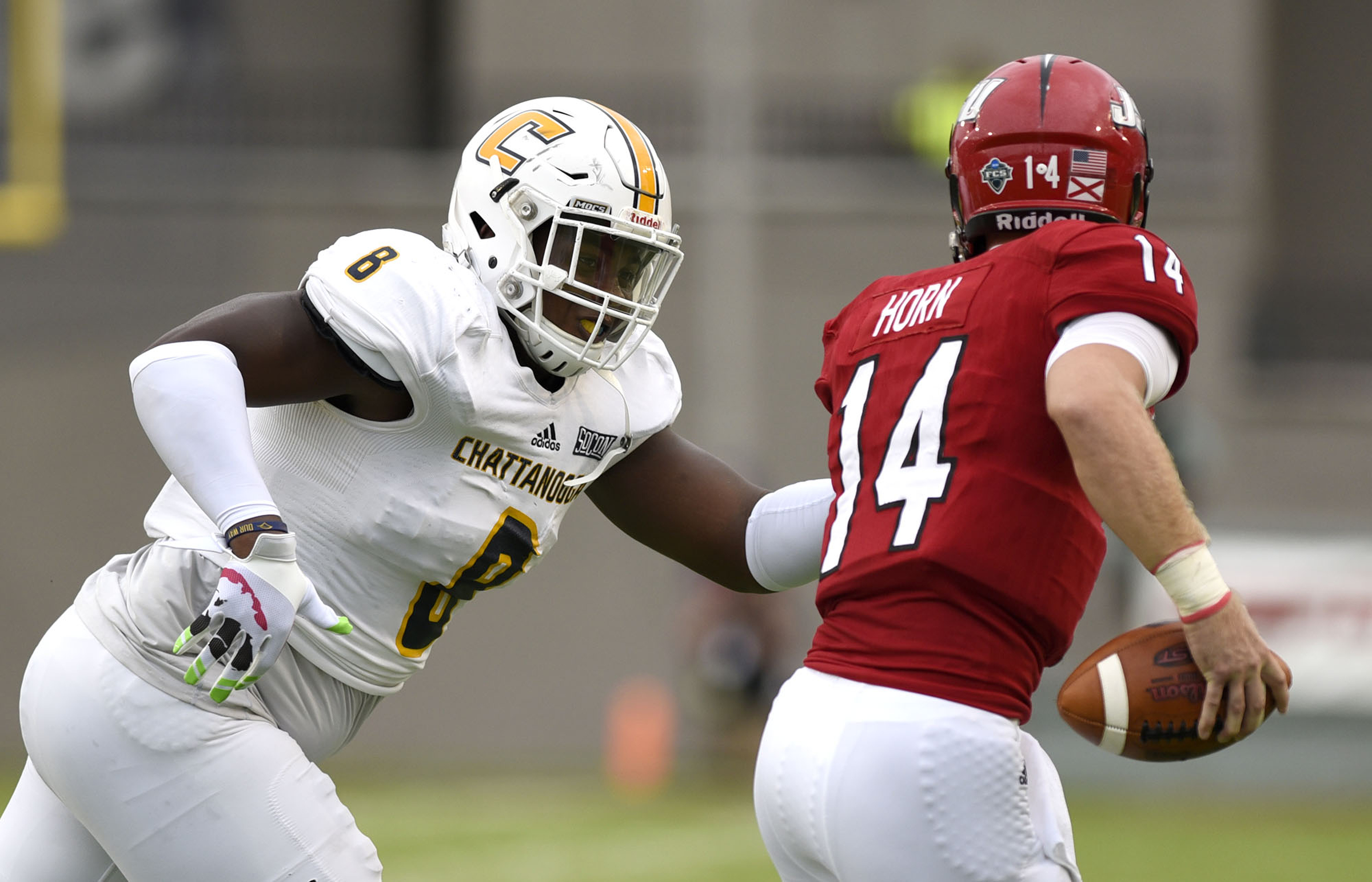 UTC's Isaiah Mack (8) runs Jacksonville quarterback Bryant Horn (14) out of the pocket. The University of Chattanooga Mocs met the Jacksonville State Gamecocks in the Guardian Credit Union FCS Kickoff at the Carmton Bowl in Montgomery, Alabama on August 26, 2017.