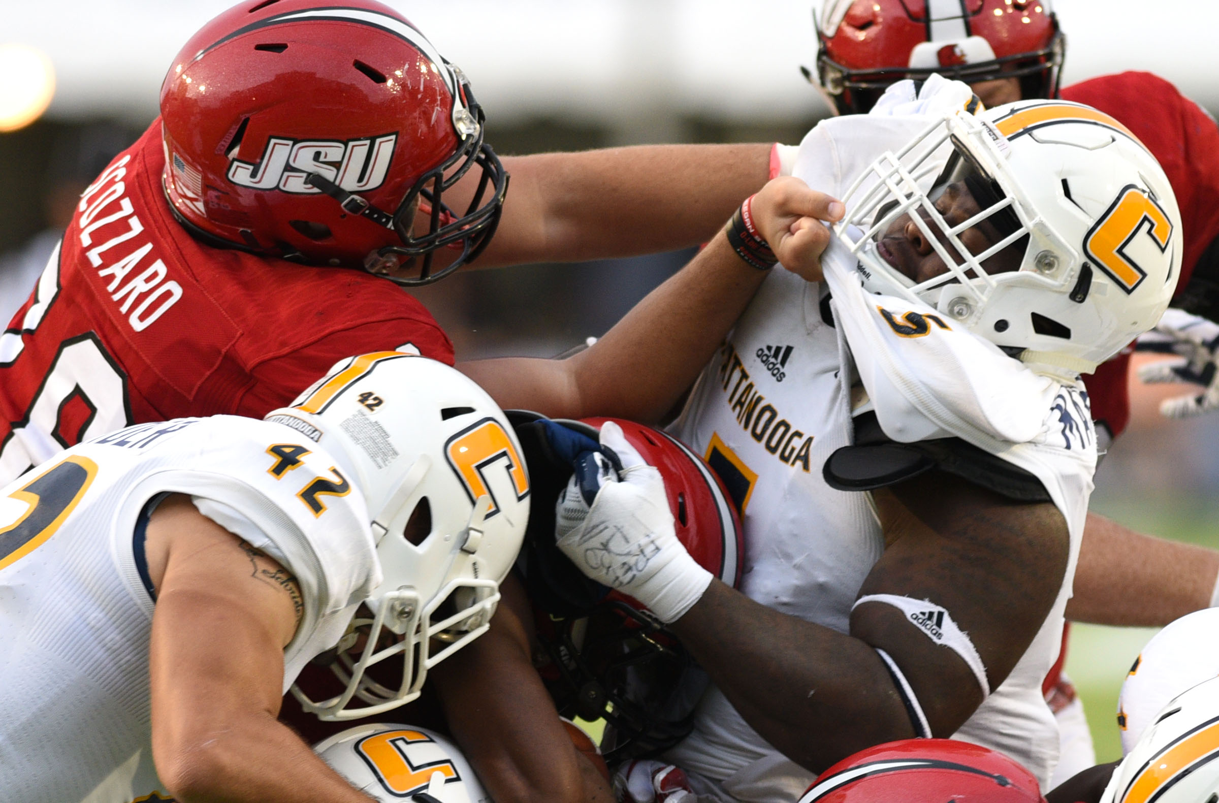 UTC's Derek Mahaffey (5) is blocked by Jacksonville's Tyler Scozzaro (78). The University of Chattanooga Mocs met the Jacksonville State Gamecocks in the Guardian Credit Union FCS Kickoff at the Carmton Bowl in Montgomery, Alabama on August 26, 2017.