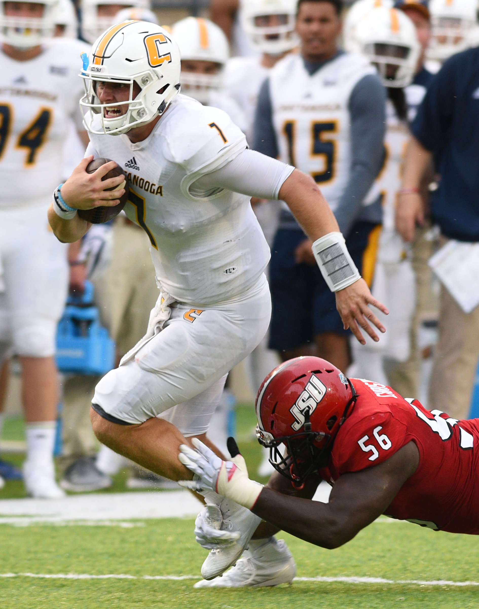 UTC quarterback Nick Tiano (7) is tripped up by Jacksonville's Connor Christian (56). The University of Chattanooga Mocs met the Jacksonville State Gamecocks in the Guardian Credit Union FCS Kickoff at the Carmton Bowl in Montgomery, Alabama on August 26, 2017.