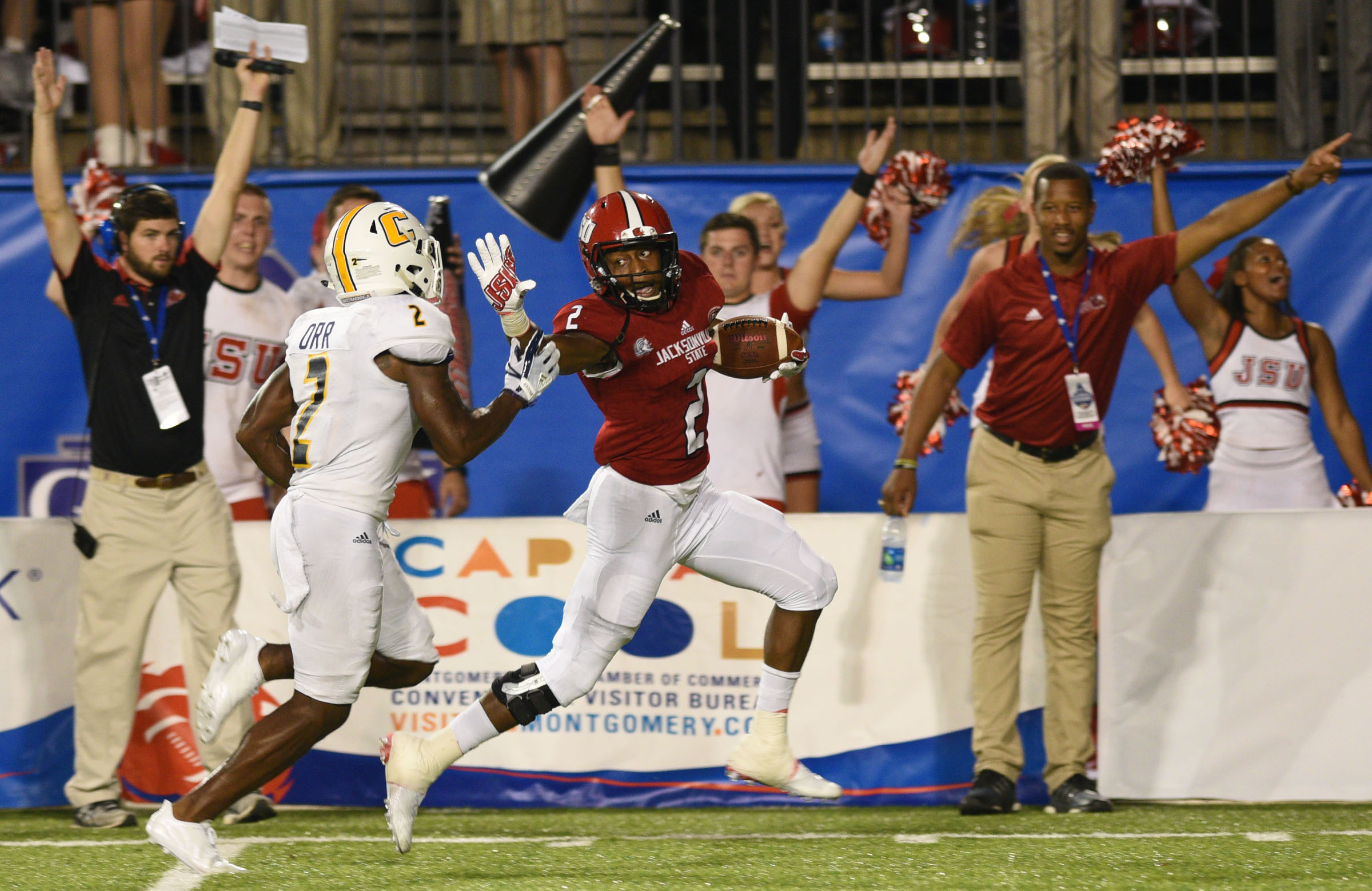 Jacksonsville's Shaq Davidson (2) goes for a touchdown as UTC's Kareem Orr (2) chases him. The University of Chattanooga Mocs met the Jacksonville State Gamecocks in the Guardian Credit Union FCS Kickoff at the Carmton Bowl in Montgomery, Alabama on August 26, 2017.