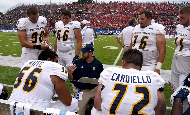 The offensive line discusses play between series.  The University of Chattanooga Mocs met the Jacksonville State Gamecocks in the Guardian Credit Union FCS Kickoff at the Carmton Bowl in Montgomery, Alabama on August 26, 2017. 