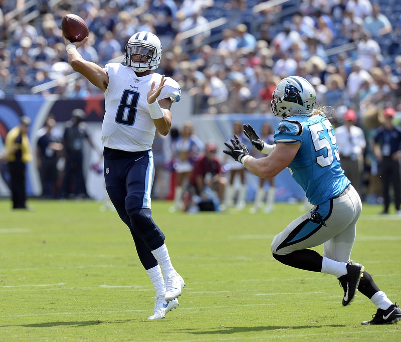 File-This Aig. 19, 2017, file photo shows Tennessee Titans quarterback Marcus Mariota (8) passing as he is pressured by Carolina Panthers linebacker David Mayo (55) in the first half of an NFL football preseason game in Nashville, Tenn. The Titans believe Mariota is ready to blossom as a quarterback in his third NFL season, so they're giving him a bit more responsibility. They're trusting Mariota to make sure the Titans have the right play called before snapping the ball. (AP Photo/Mark Zaleski, File)