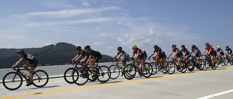 The women's Category 3-5 road race peloton returns across the U.S. Highway 41 bridge on the final day of the River Gorge Omnium on Sunday, Aug. 27, in Haletown, Tenn. Jennifer Nielson (728) would win the road race and Beth Lofgren (711) would win the women's Category 4-5 omnium.