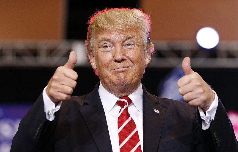 
              FILE - In this Aug. 22, 2017, file photo, President Donald Trump reacts before speaking at a rally at the Phoenix Convention Center in Phoenix. The Trump administration is preparing to restore the flow of surplus military equipment to local law enforcement agencies. (AP Photo/Alex Brandon, File)
            