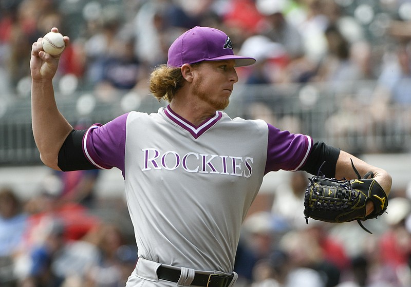 Colorado Rockies' Jon Gray pitches against the Atlanta Braves during the first inning of a baseball game, Sunday, Aug. 27, 2017, in Atlanta. (AP Photo/John Amis)