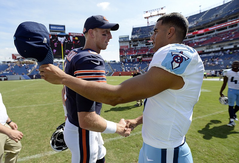 
              Chicago Bears quarterback Mike Glennon, left, greets Tennessee Titans quarterback Marcus Mariota, right, after an NFL football preseason game Sunday, Aug. 27, 2017, in Nashville, Tenn. The Bears won 19-7. (AP Photo/Mark Zaleski)
            