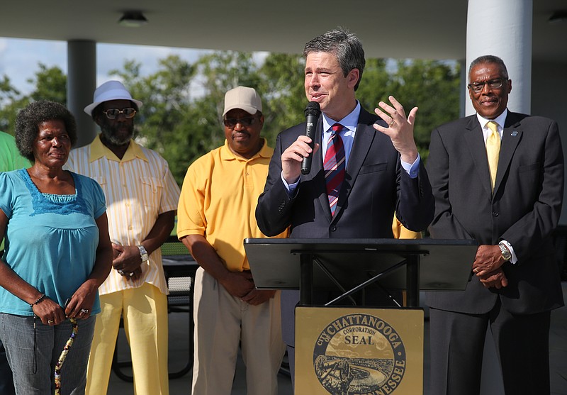 Chattanooga Mayor Andy Berke speaks during the ribbon-cutting ceremony. "It's been a long time coming," Berke said at the park's pavilion, complete with checkerboard tables and seats. "It only happened because of the power and the strength of the people who stand behind me and the leadership that made sure it happened over the course of the last several years." (Staff photo by Erin O. Smith)