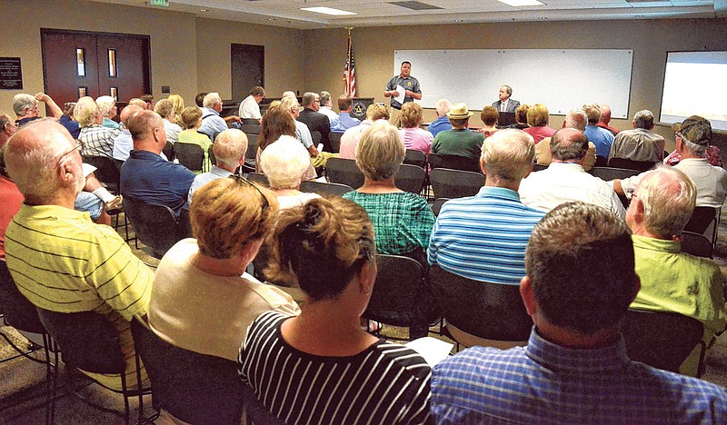 Walker County Fire Chief and Emergency Management Director Blake Hodge addresses citizens in the meeting room at the Walker County-LaFayette Public Library. Walker County Commissioner Shannon Whitfield recently held five public hearings throughout the county to discuss proposed tax increases and establishment of a public safety fee.