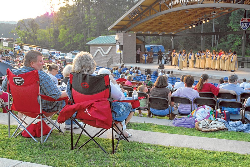 Warren Coker and his wife, Jan, listen to Mount Peria Choir at the grand opening of the Northwest Georgia Bank Amphitheatre at Benton Place Campus in Catoosa County.