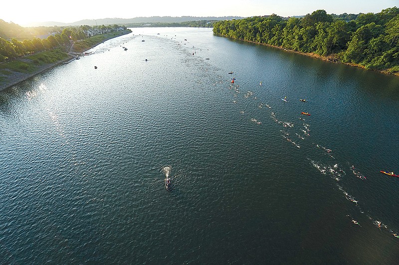Staff Photo by Dan Henry / The Chattanooga Times Free Press- 5/22/16. Age group competitors fill the Tennessee River and begin the swim portion of the 2016 Sunbelt Bakery Ironman 70.3 event in downtown Chattanooga on Sunday, May 22. 