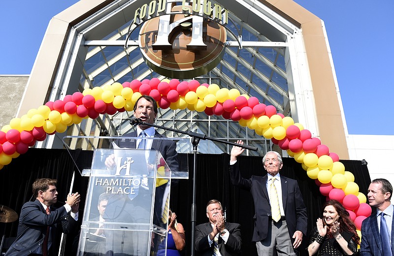 CBL President and CEO Stephen Lebovitz introduces his father, CBL Chairman Charles B. Lebovitz during festivities in August celebrating Hamilton Place mall's 30th anniversary. Also present of the stage, from left are Congressman Chuck Fleischmann, Chattanooga Mayor Andy Berke (obscured), Hamilton Place Marketing Director Kim Lyons (obscured), Hamilton County Mayor Jim Coppinger, singer Tiffany Darwich, and CBL Senior Vice President Allan L. Lebovitz.