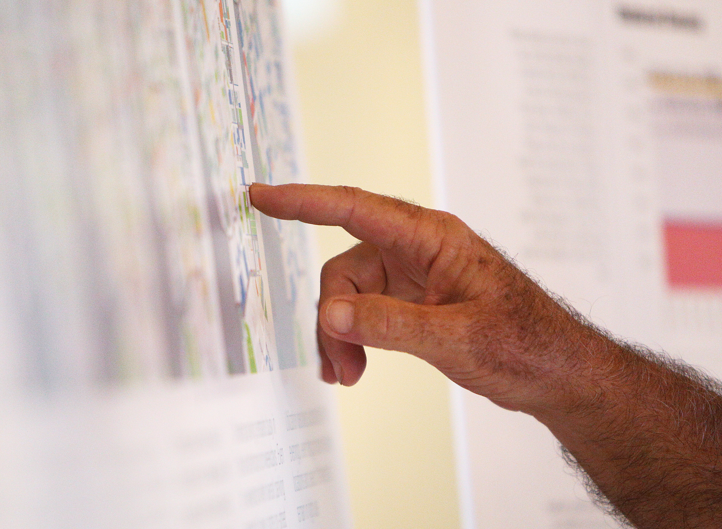 Community members check out maps and diagrams of parking studies being performed in downtown Chattanooga Monday, Aug. 28, 2017, at the Bessie Smith Cultural Center in Chattanooga, Tenn. The parking study was performed to determine if more parking spaces are needed in the downtown area and how to make the best use of the current parking spaces provided.