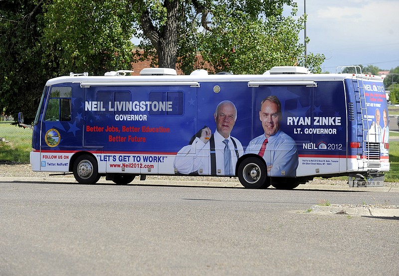 
              This July 14, 2011 photo shows the campaign bus of Neil Livingstone, candidate for Governor and Ryan Zinke, candidate for Lt. Governor in Great Falls, Mont. A political committee belonging to Interior Secretary Ryan Zinke recently sold the motorhome to a Montana legislator who is up for a top post in the Interior Department, Thursday, Aug. 17, 2017. The sale is prompting curiosity because it was sold for just half of its apparent $50,000 market value. The Federal Election Commission prohibits the sale of political committee assets below fair market value. (Rion Sander/The Great Falls Tribune via AP, File)
            