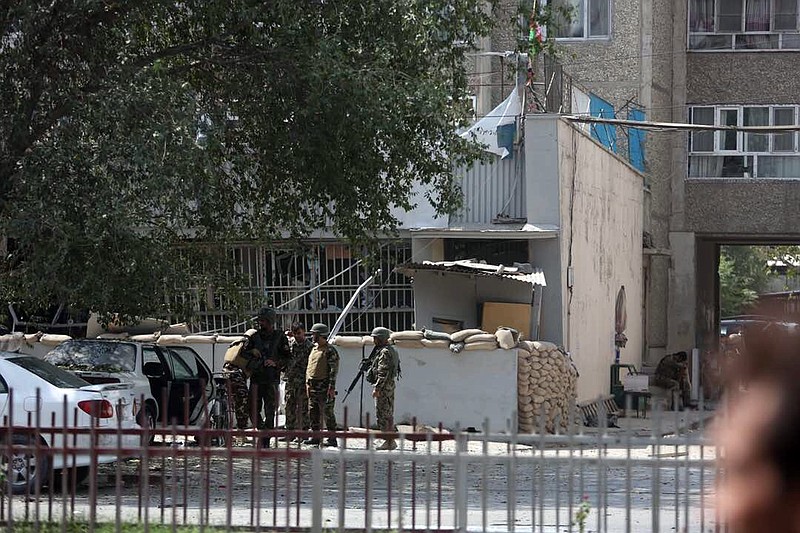 
              Afghan security personnel arrive at the site of an explosion near a bank in Kabul, Afghanistan, Tuesday, Aug. 29, 2017. The area where the explosion took place, in the center of the Afghan capital, is home to many businesses. The U.S. Embassy and the NATO headquarters are about 500 meters (yards) away. (AP Photo/Rahmat Gul)
            